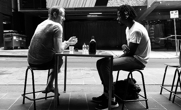 photo-of-two-men-talking-while-sitting-on-chair-2420585.jpg